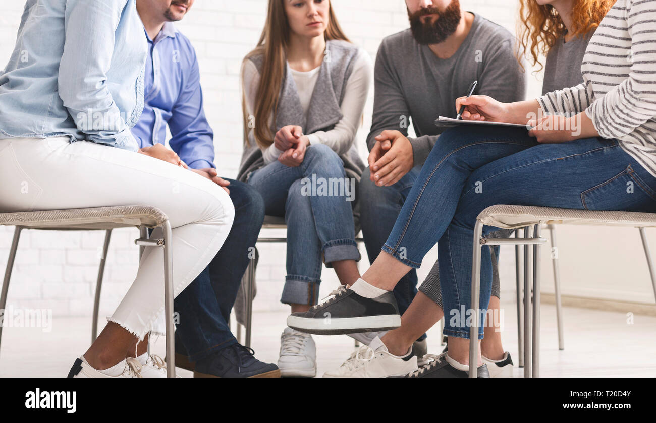 Therapist speaking to a rehab group at therapy session Stock Photo