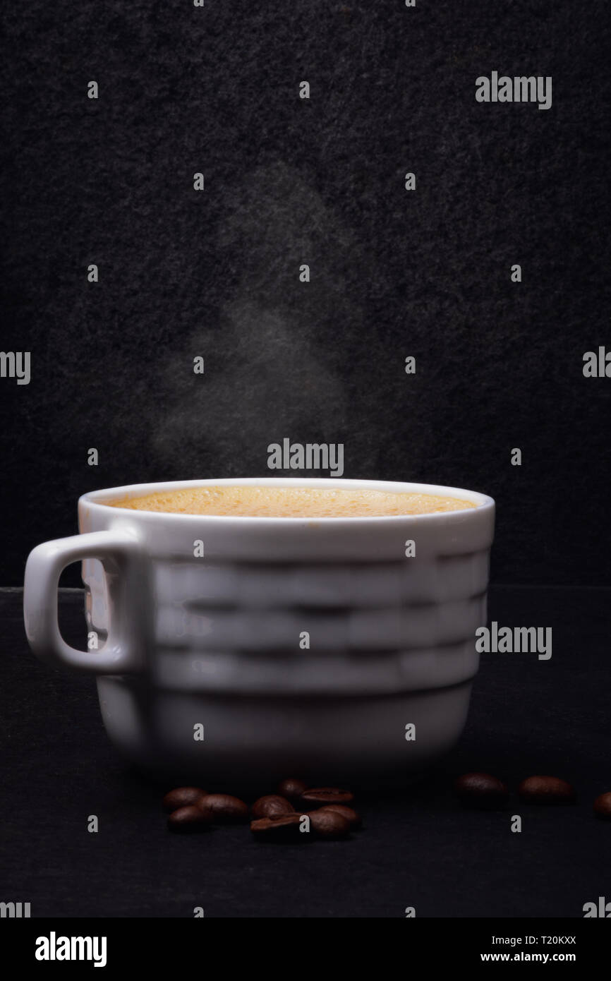 Cup of hot coffee on black background Stock Photo Alamy
