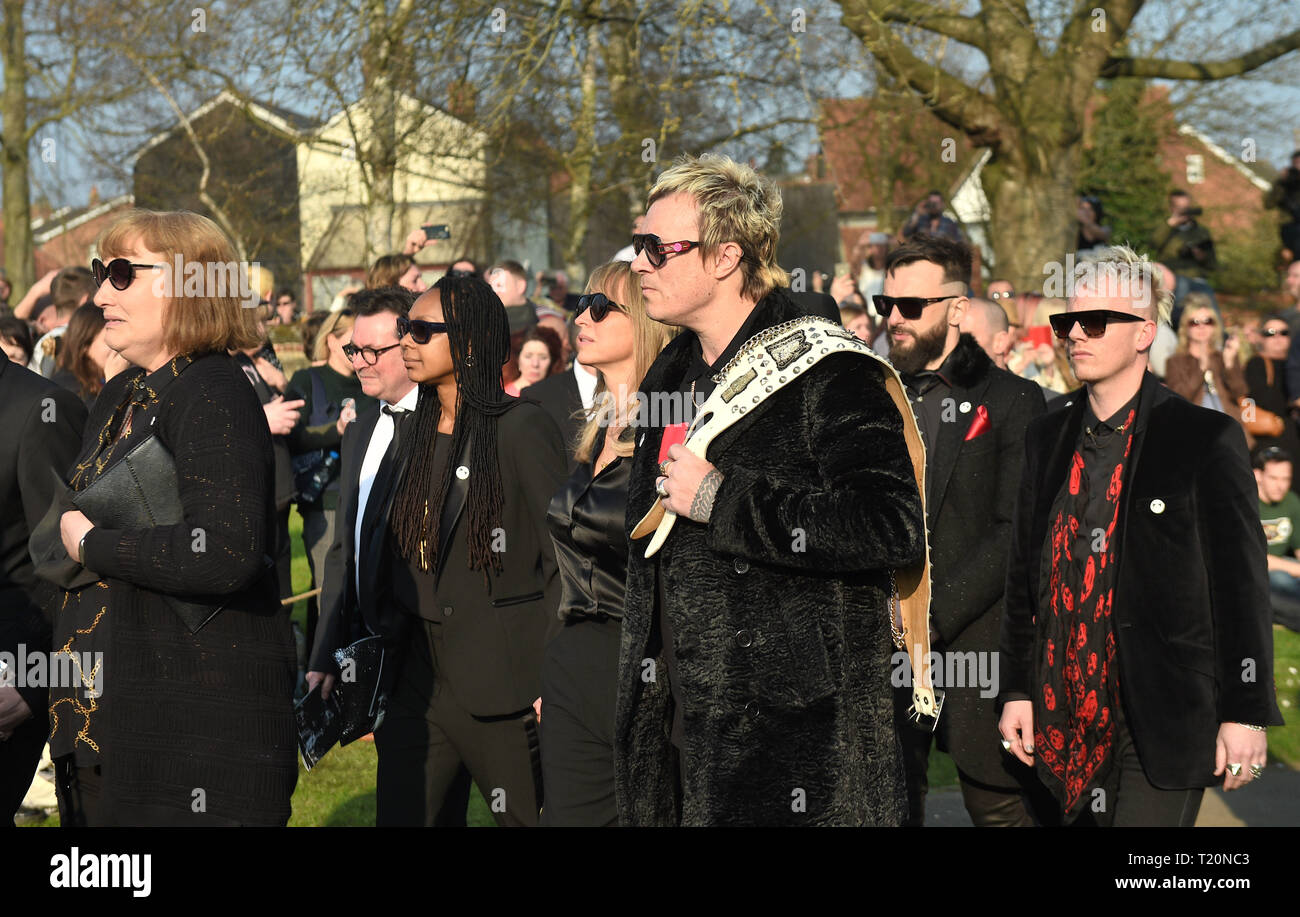 Bandmate Liam Howlett (centre) arrives the funeral of Keith Flint in Bocking, Essex. Stock Photo