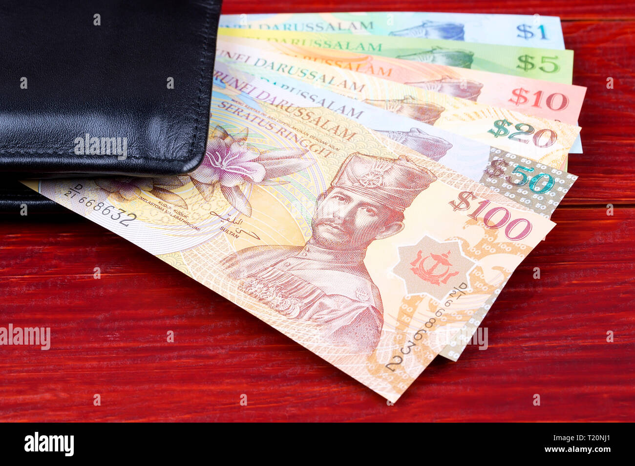 Brunei money in the black wallet Stock Photo Alamy