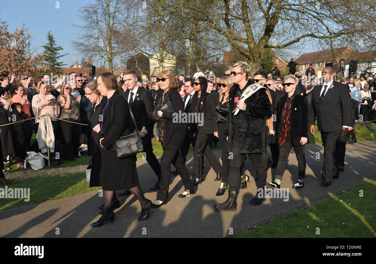 Bandmate Liam Howlett (centre right) arrives the funeral of Keith Flint in Bocking, Essex. Stock Photo