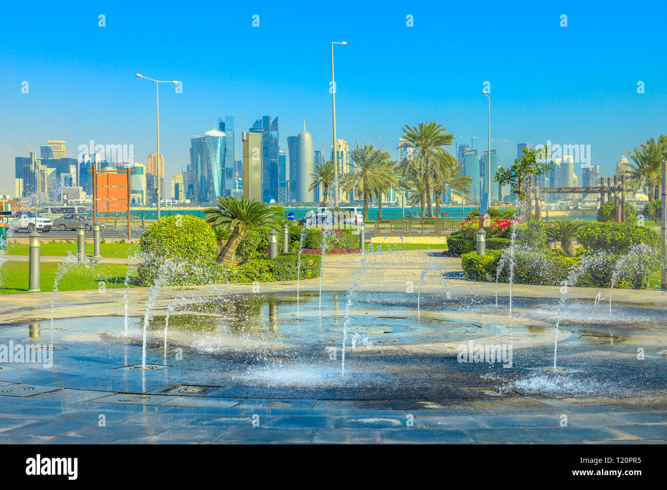 Water fountain at Souq Waqif Park in Doha Corniche with Doha West Bay ...