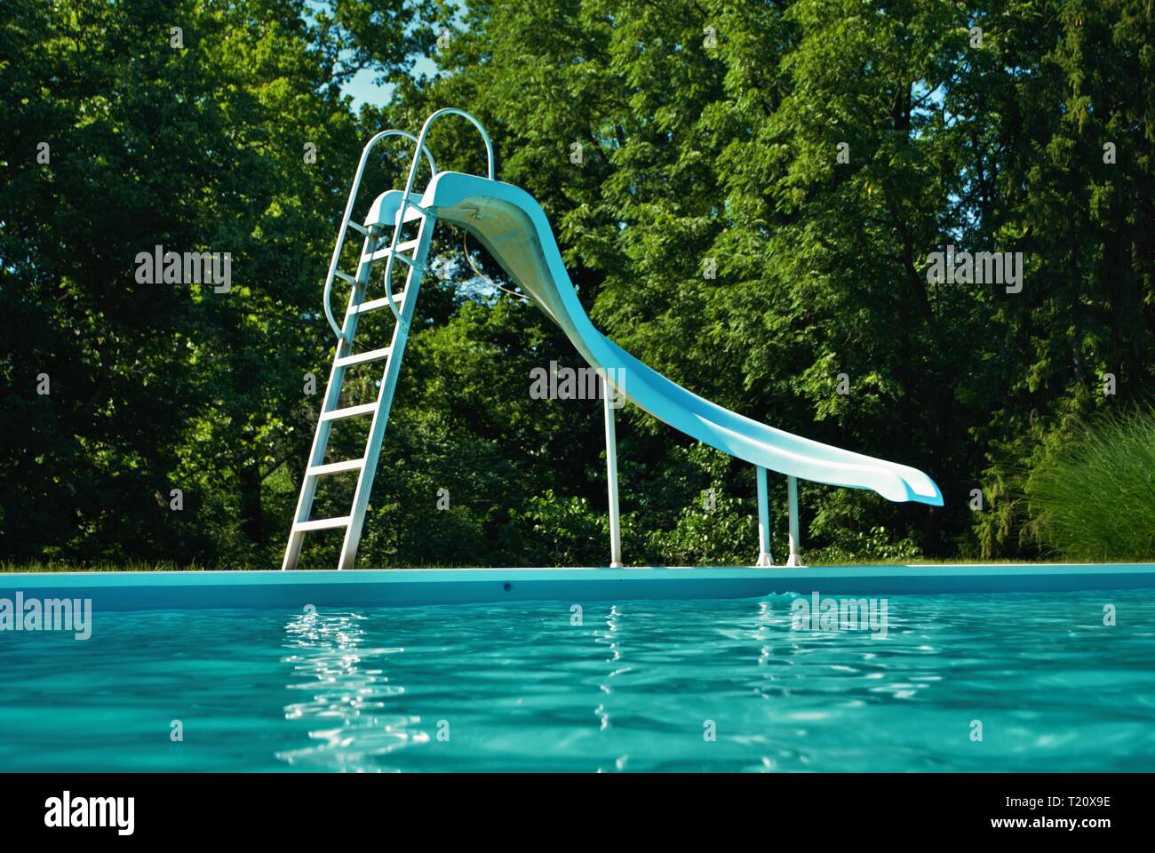 Water level view of a poolside on a bright and sunny day Stock Photo
