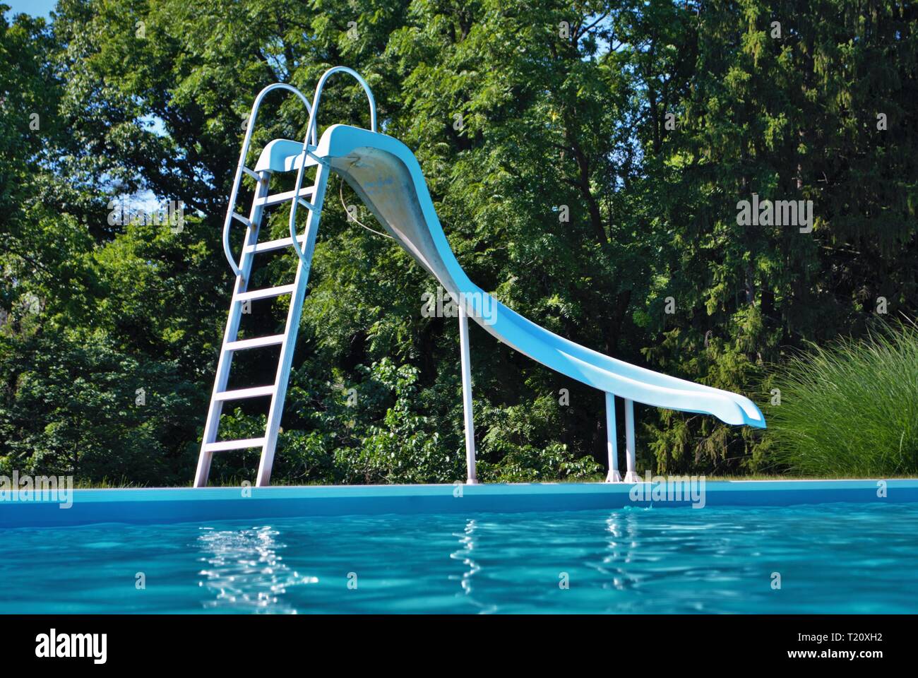 Water level view of a poolside on a bright and sunny day Stock Photo