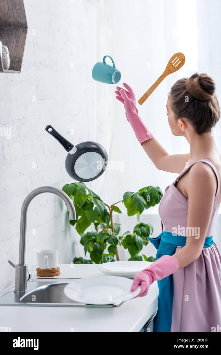 Women washing cooking utensils hi-res stock photography and images - Alamy