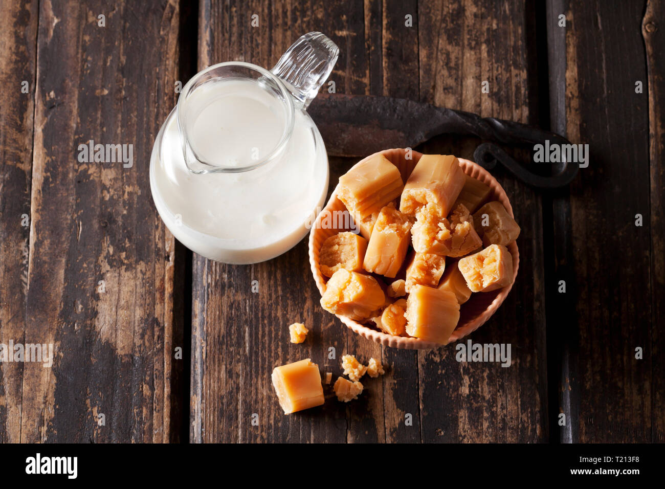 Fresh cream toffees and a carafe of cream Stock Photo