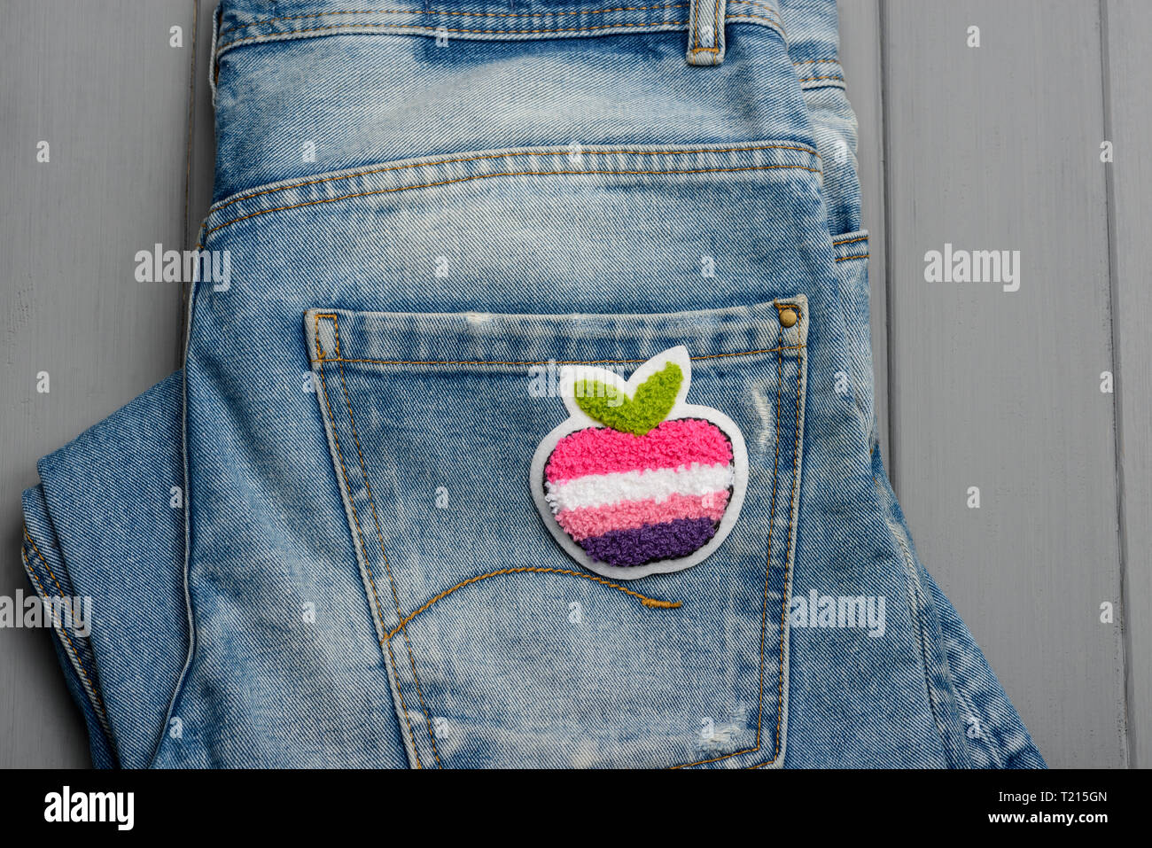 Apple fabric patch on denim Stock Photo