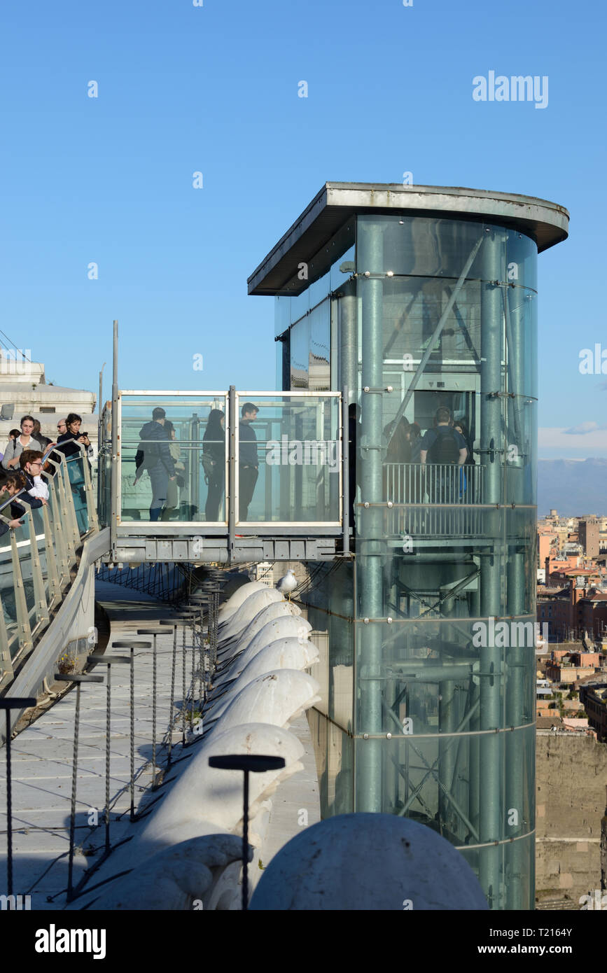 Tourists & Exterior Elevator or Lift Leading to the Roof Terrace, Viewpoint or Observation Point of the Vittorio Emanuele II Monument  Rome Italy Stock Photo