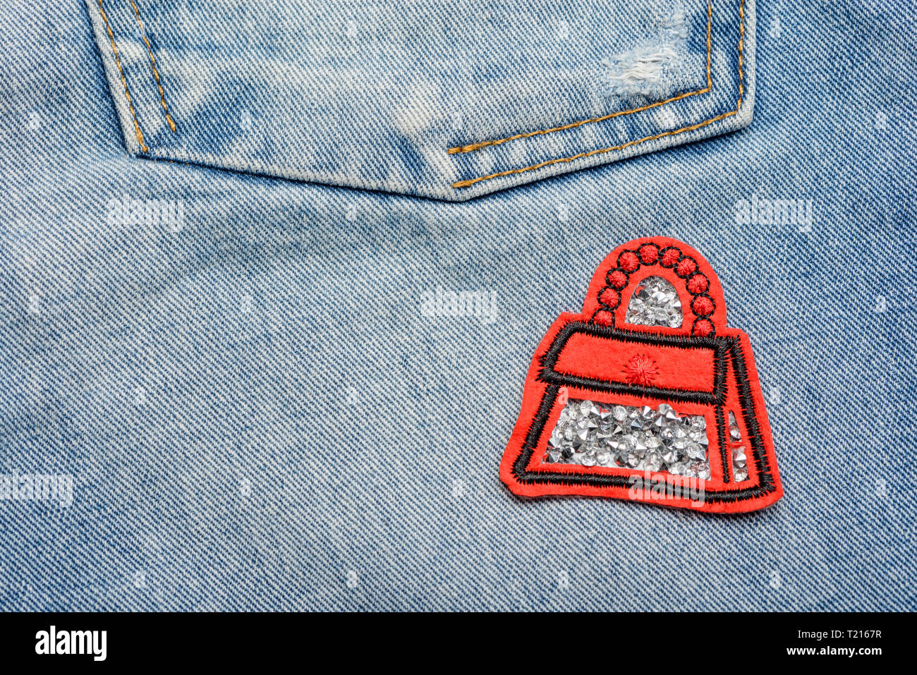 Red bag patch with rhinestones. Stock Photo
