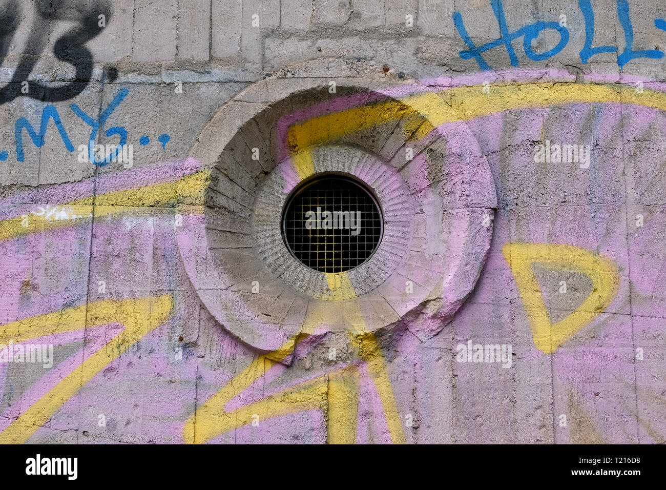 Ventilation hole of a bunker with graffiti. Stock Photo