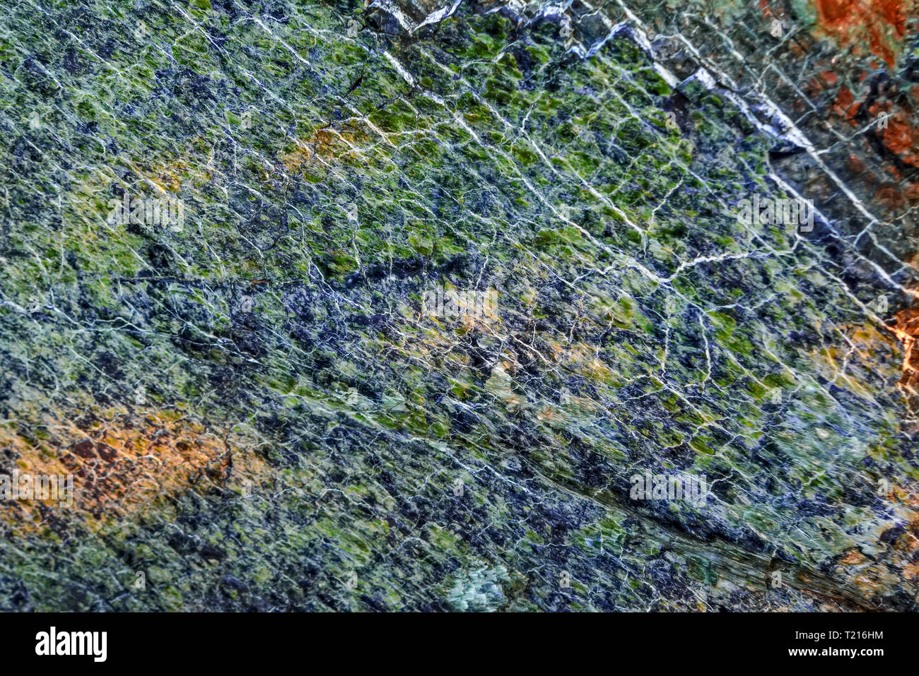 background, texture - rough surface of cliff from serpentinite, natural ...