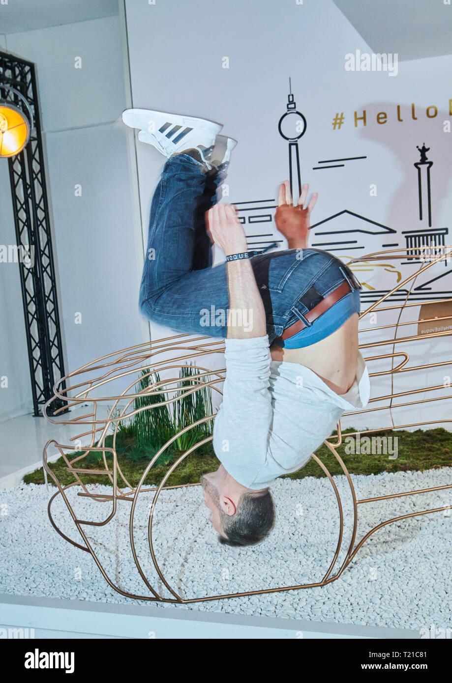 Berlin, Germany. 28th Mar, 2019. Parkour athlete Amadei Weiland makes a somersault at the EVOQUE X BERLIN event, a Land Rover event. Credit: Annette Riedl/dpa/Alamy Live News Stock Photo