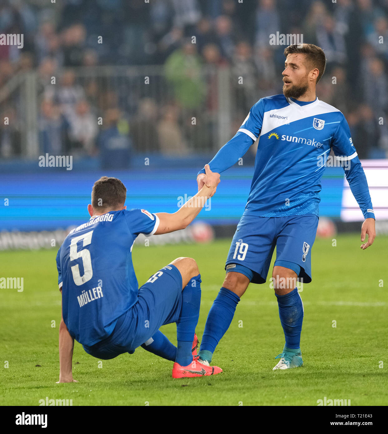 29 March 2019, Saxony-Anhalt, Magdeburg: Soccer: 2nd Bundesliga, 27th matchday, 1st FC Magdeburg - 1st FC Heidenheim in the MDCC-Arena in Magdeburg. Magdeburg's Tobias Müller (l) and Michel Niemeyer are standing on the grass after the match. Photo: Peter Steffen/dpa - IMPORTANT NOTE: In accordance with the requirements of the DFL Deutsche Fußball Liga or the DFB Deutscher Fußball-Bund, it is prohibited to use or have used photographs taken in the stadium and/or the match in the form of sequence images and/or video-like photo sequences. Stock Photo