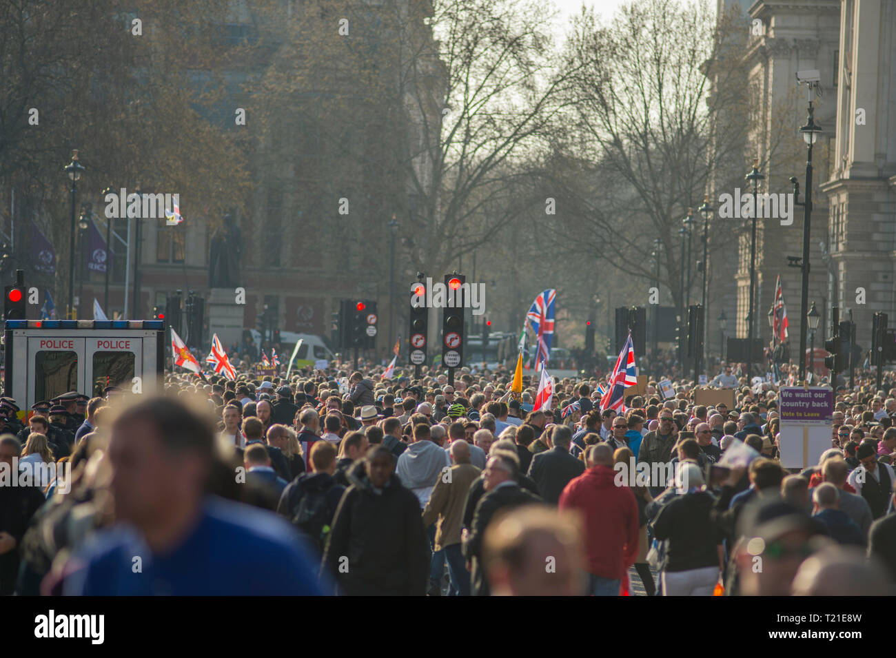 Westminster London, UK. 29 March, 2019. Thousands of Leave supporters gather outside Parliament as MPs reject the Prime Minister’s withdrawal deal by 58 votes. March to Leave rally gathers in Parliament Square to hear Nigel Farage speak. A separate Make Brexit Happen rally takes place in Whitehall, organised by UKIP with EDL’s Tommy Robinson. Image: Crowds on Bridge Street looking towards Parliament Square. Credit: Malcolm Park/Alamy Live News. Stock Photo