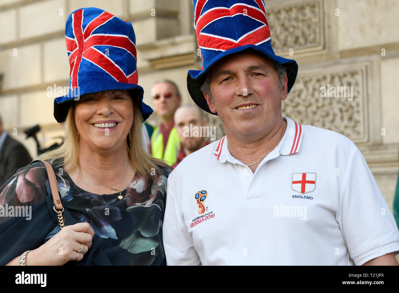 Pro Brexit supporters seen wearing blue hats with red stripes emulating the United Kingdom flag during the Leave means leave rally in London.  A Leave means leave pro Brexit march begun on March 16 in Sunderland, UK and ended with a rally in Parliament Square on March 29 in London, same day that UK has been scheduled to leave the European Union. Pro Brexit protesters gathered at Parliament Square to demand from the government to deliver what was promised and leave the European Union without a deal. Nigel Farage and Tommy Robinson were seen giving speeches to their supporters in different stage Stock Photo