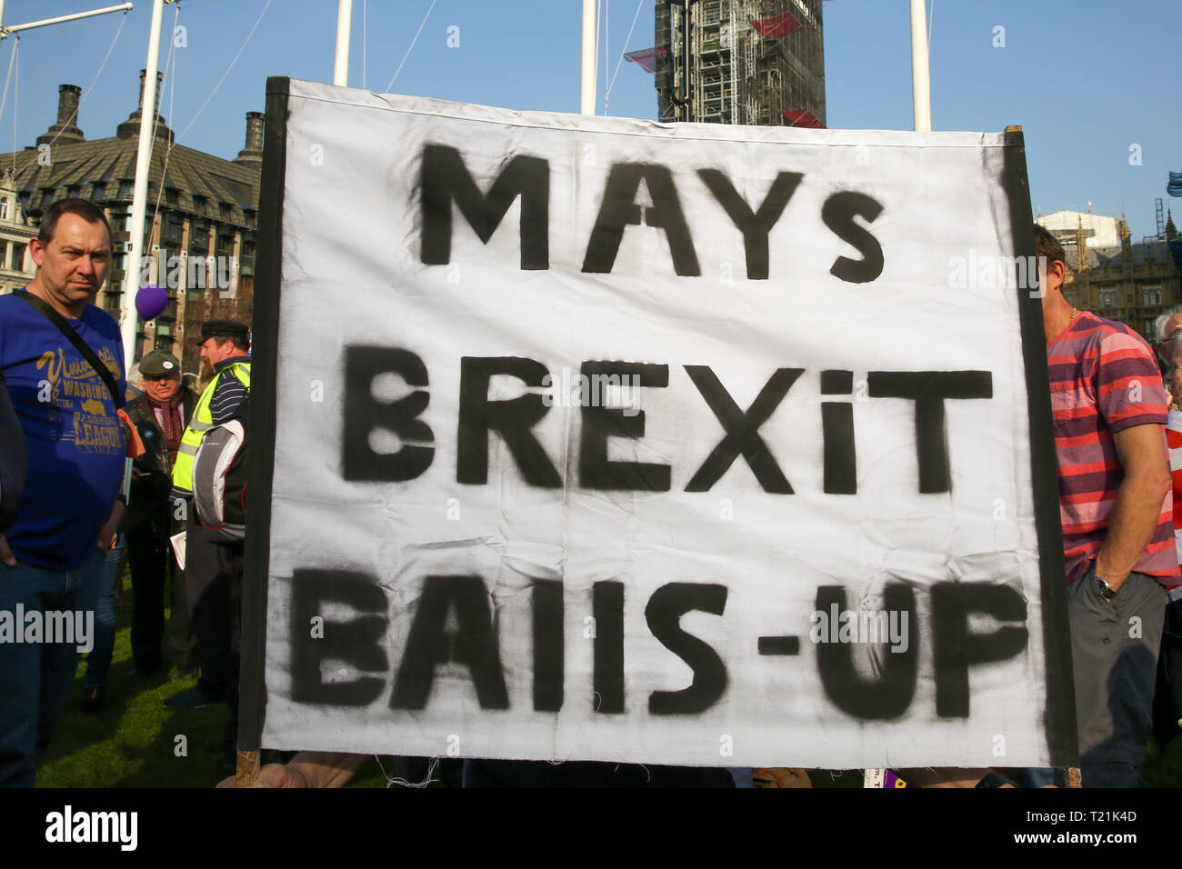 London, UK. 29th Mar, 2019. Protesters are seen holding a large banner outside House of Parliament during the demonstration. Leave campaigners protest against the delay to Brexit, on the day that UK was due to leave the European Union. British Prime Minister Theresa May’s Brexit deal was defeated for a third time by a margin of 58 votes. Credit: SOPA Images Limited/Alamy Live News Stock Photo