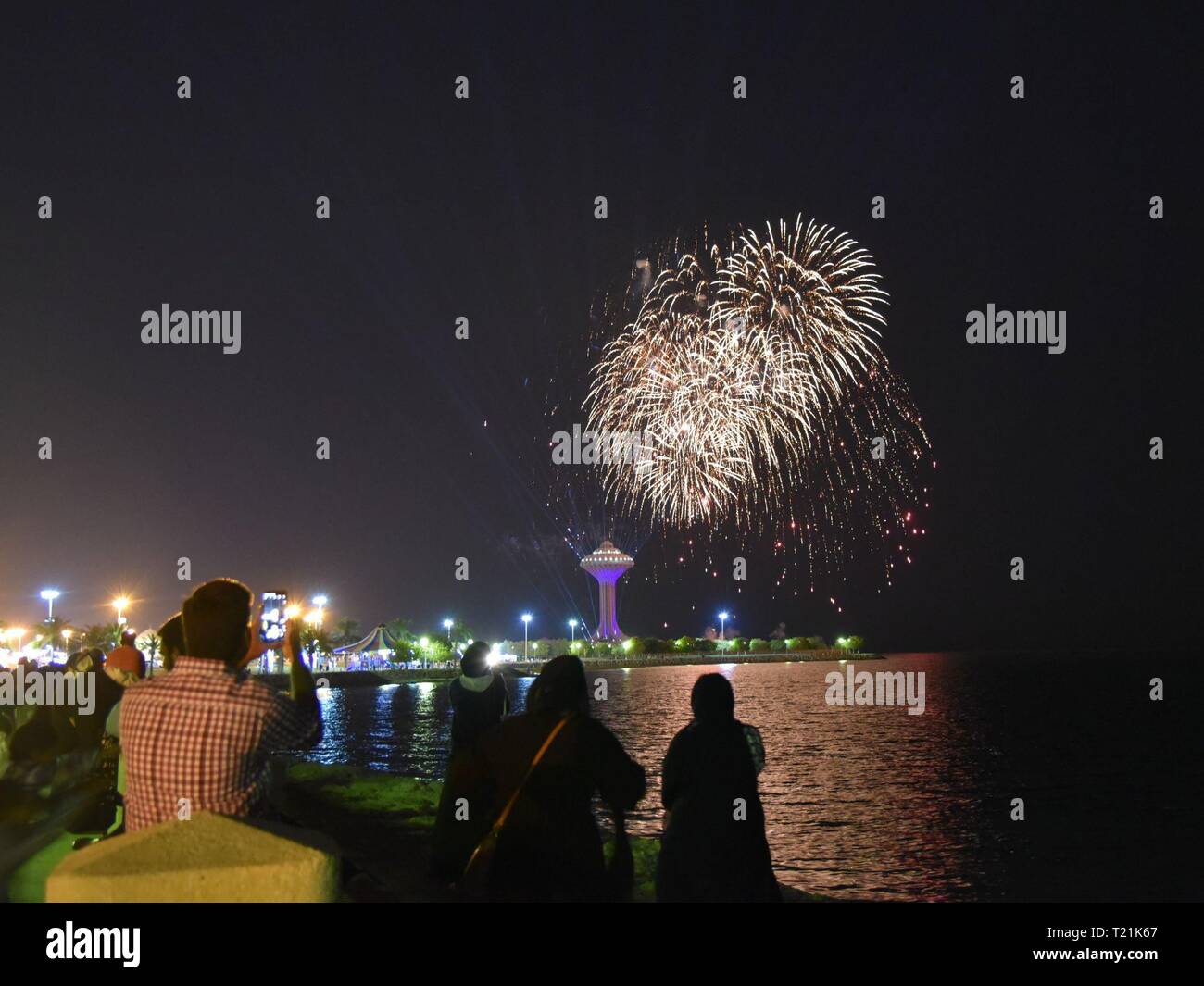 Khobar. 29th Mar, 2019. Visitors take pictures of fireworks during the Sharqiah Season by the Al-Khobar corniche in Eastern Province of Saudi Arabia, March 29, 2019. The Sharqiah Season, held in nine cities in Eastern Province, wrapped up on March 30. Over the period of 17 days, the season entailed a carefully crafted selection of over 100 programs and activities covering culture, sports, education and entertainment. Credit: Tu Yifan/Xinhua/Alamy Live News Stock Photo