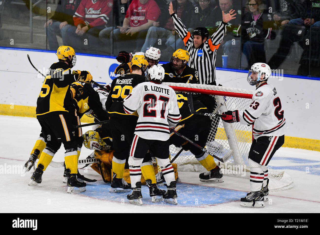 March 29, 2019 Play is stopped by the referee during the NCAA Men's Hockey West Regional semi-final game between the American International College Yellow Jackets and the St. Cloud State Huskies at Scheels Arena, Fargo, ND. #16 AIC defeated #1 SCSU 2-1. Photo by Russell Hons/CSM Stock Photo