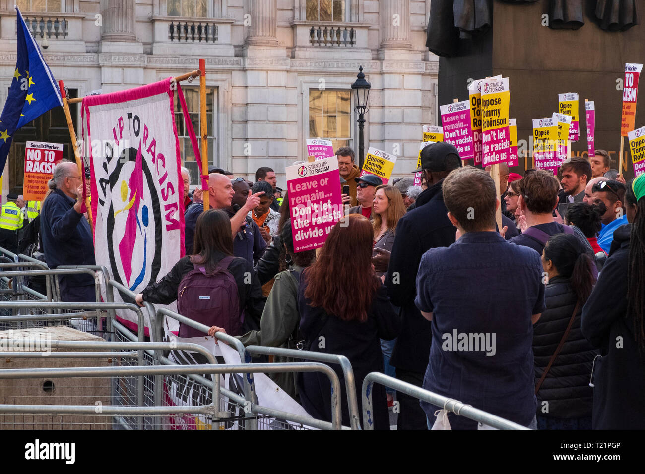 London, UK. 29th Mar, 2019. the day the UK was due to leave the EU. Near Downing Street on Whitehall a secure police cordon pens in demonstrators from the Stand Up to Racism group involved in a counter-demonstration to the pro-Brexit groups in Parliament Square. Credit: Scott Hortop/Alamy Live News. Stock Photo