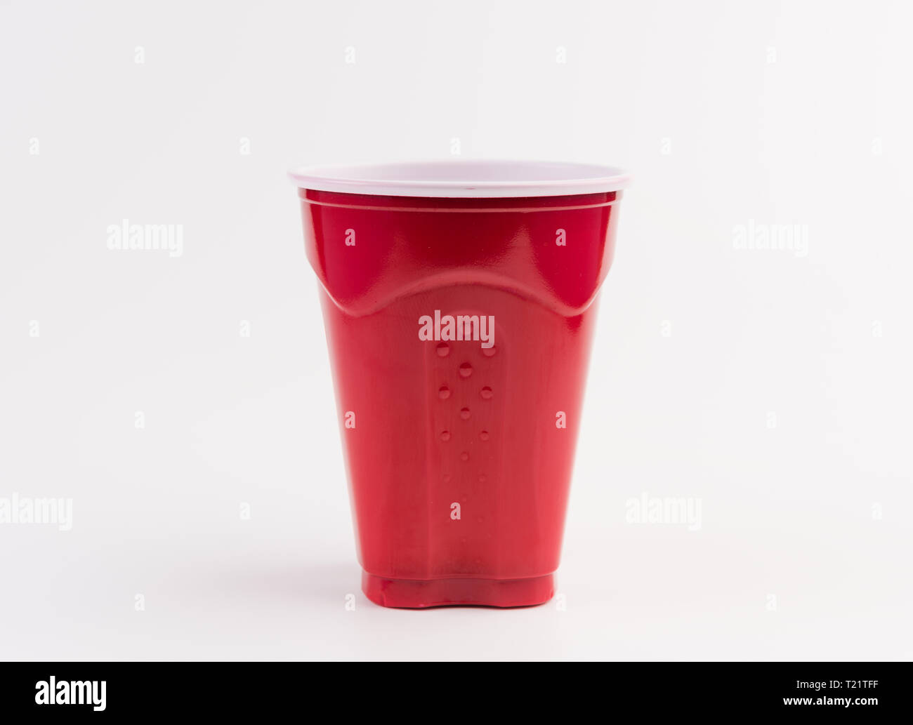 Empty red plastic cup isolated on white Stock Photo