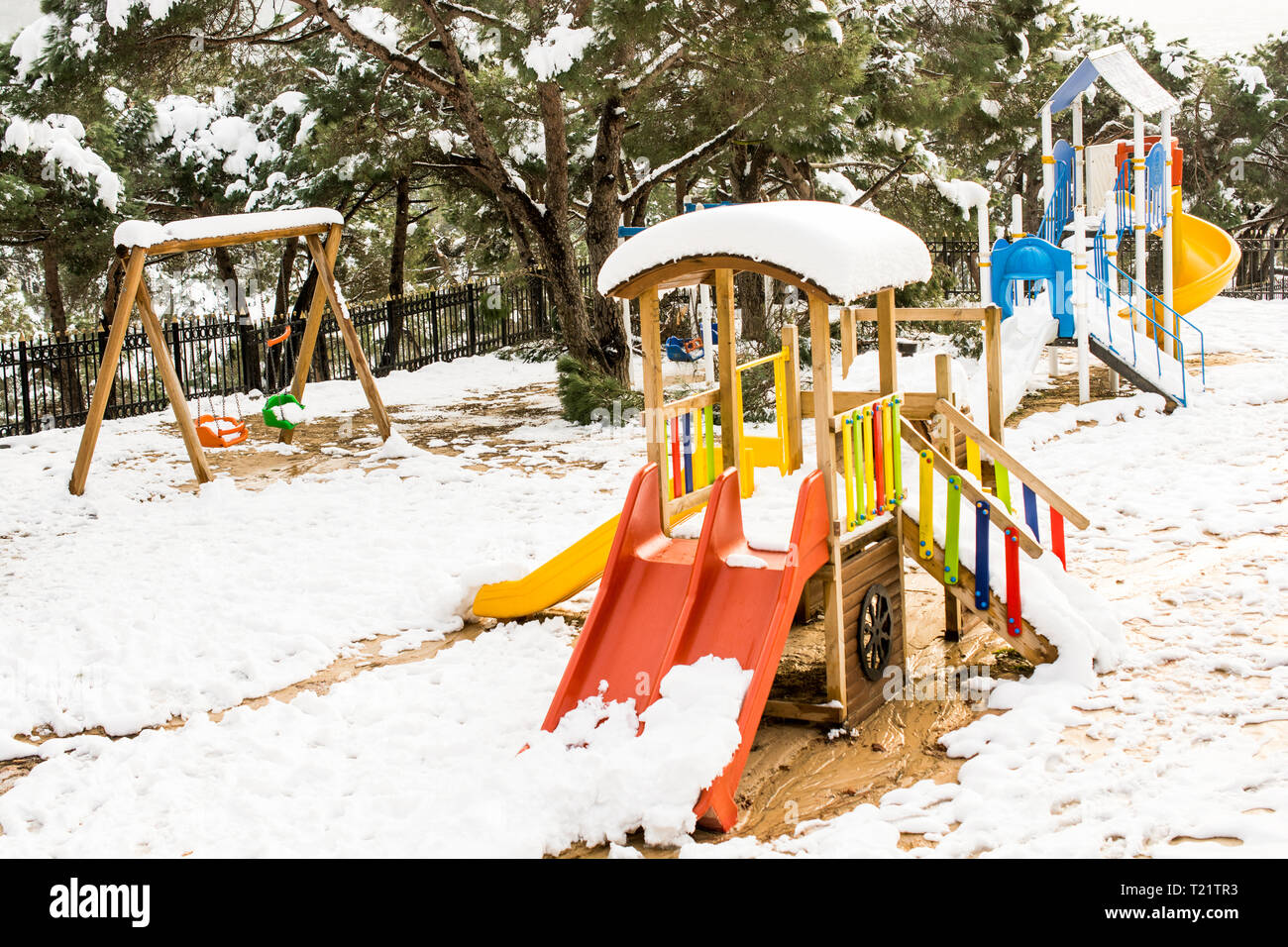 Colorful kids playground caovered in snow in winter Stock Photo - Alamy
