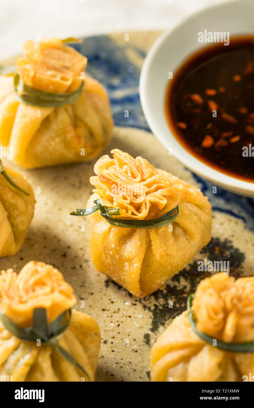 Homemade Deep Fried Shrimp Purse Dumplings with Soy Sauce Stock Photo