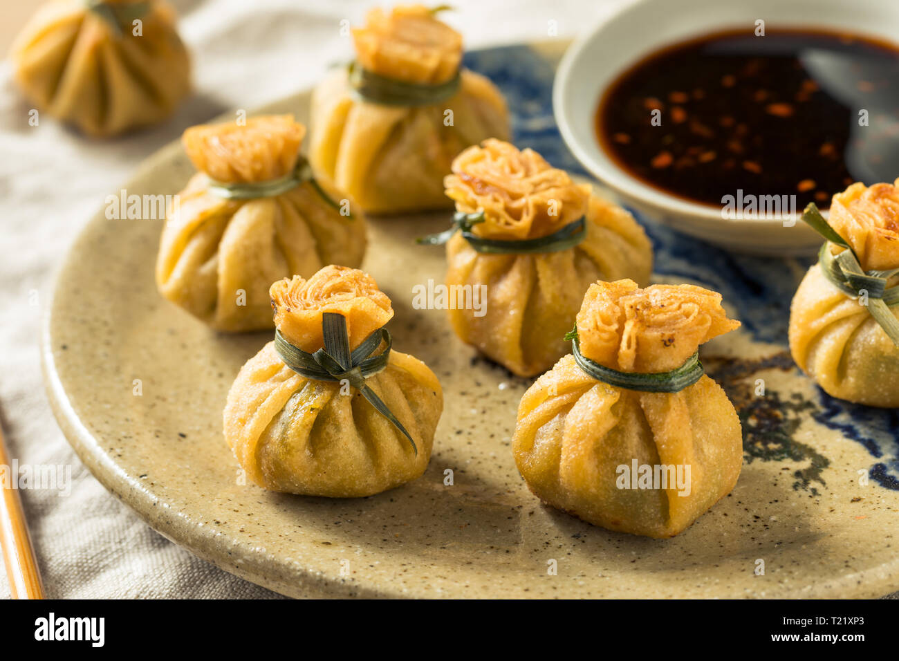 Homemade Deep Fried Shrimp Purse Dumplings with Soy Sauce Stock Photo
