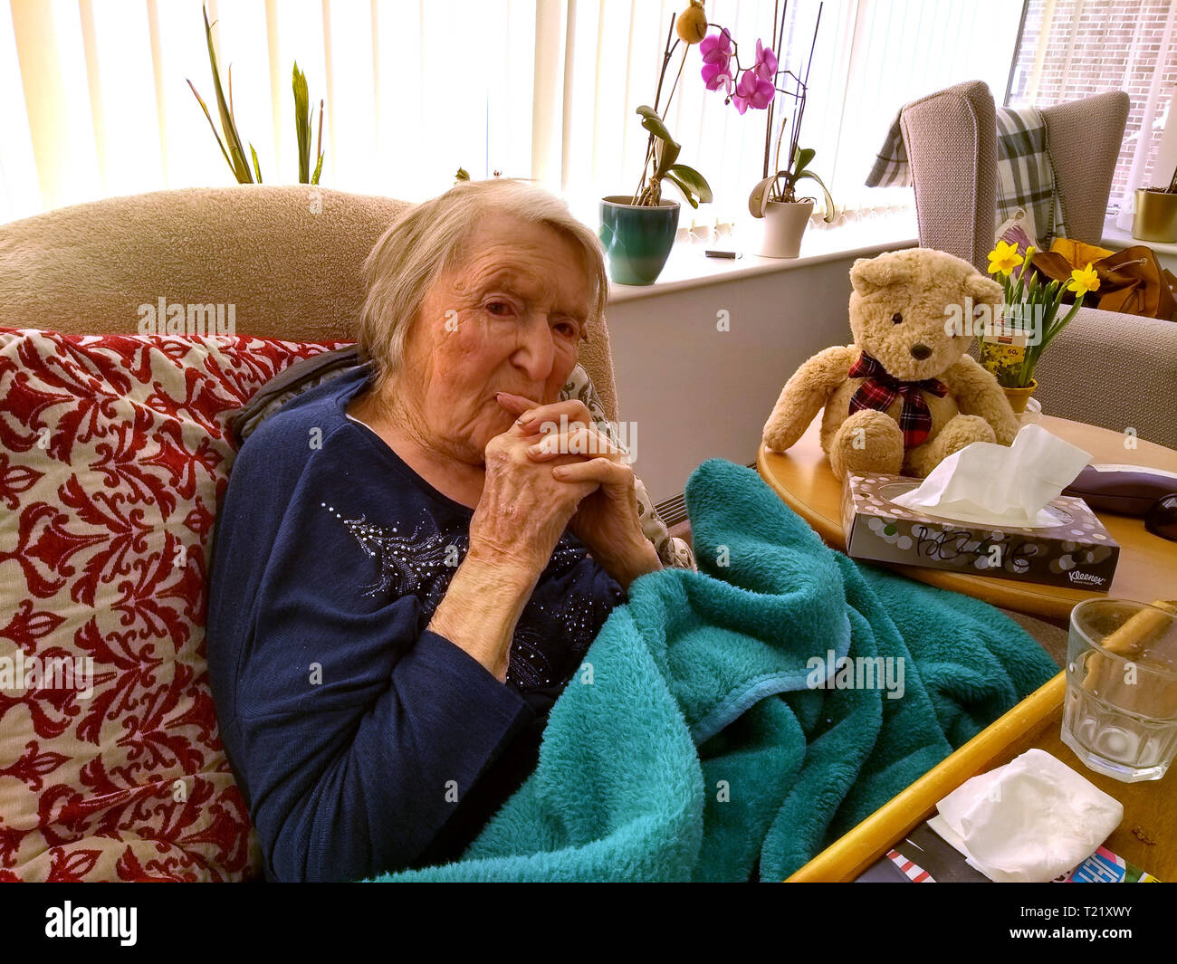 Old lady aged 104 years old deep in thought in a care home Britain, Uk centenarian 100 years old year Stock Photo