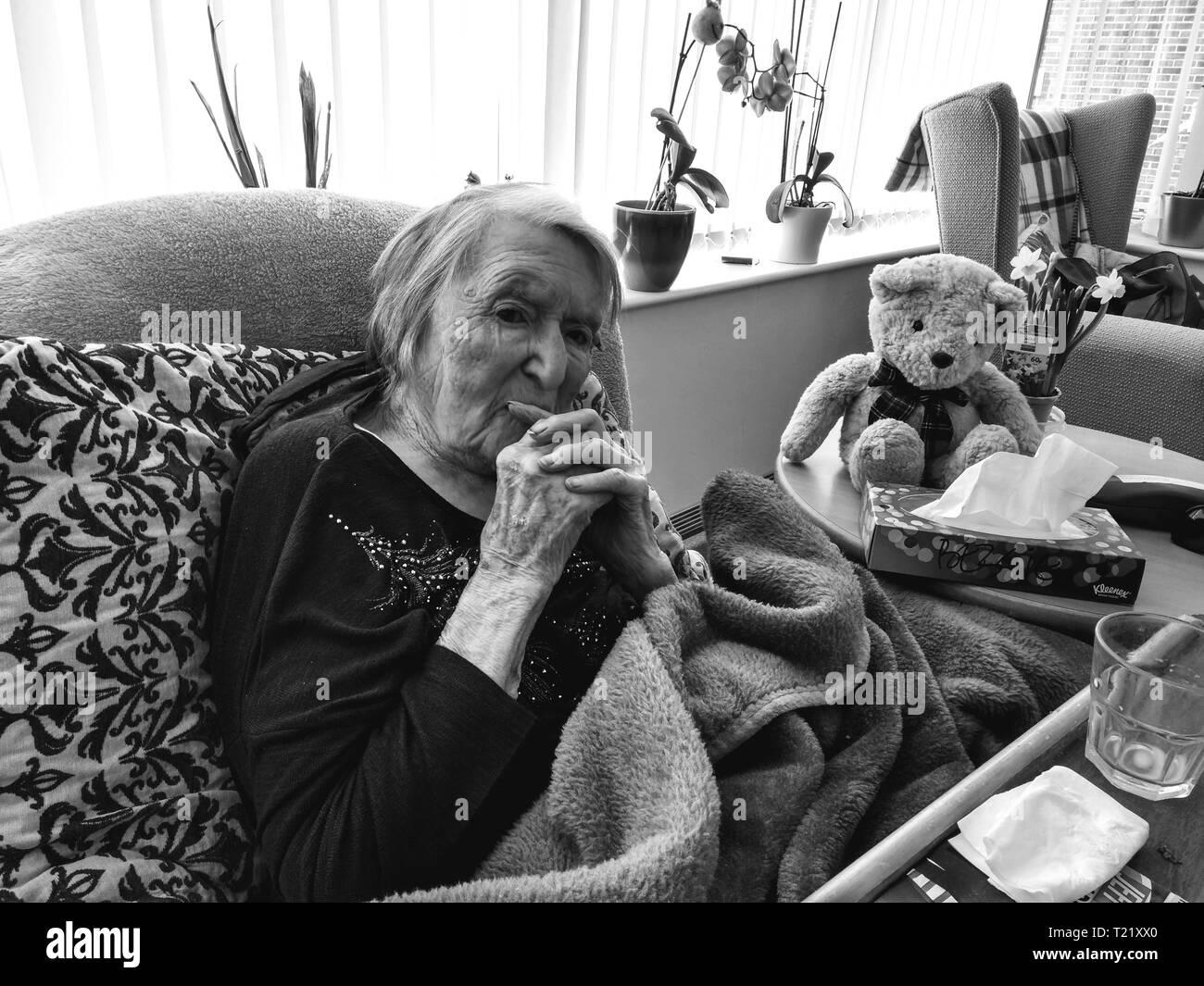 Old lady aged 104 years old deep in thought in a care home Britain, Uk centenarian 100 years old year Stock Photo