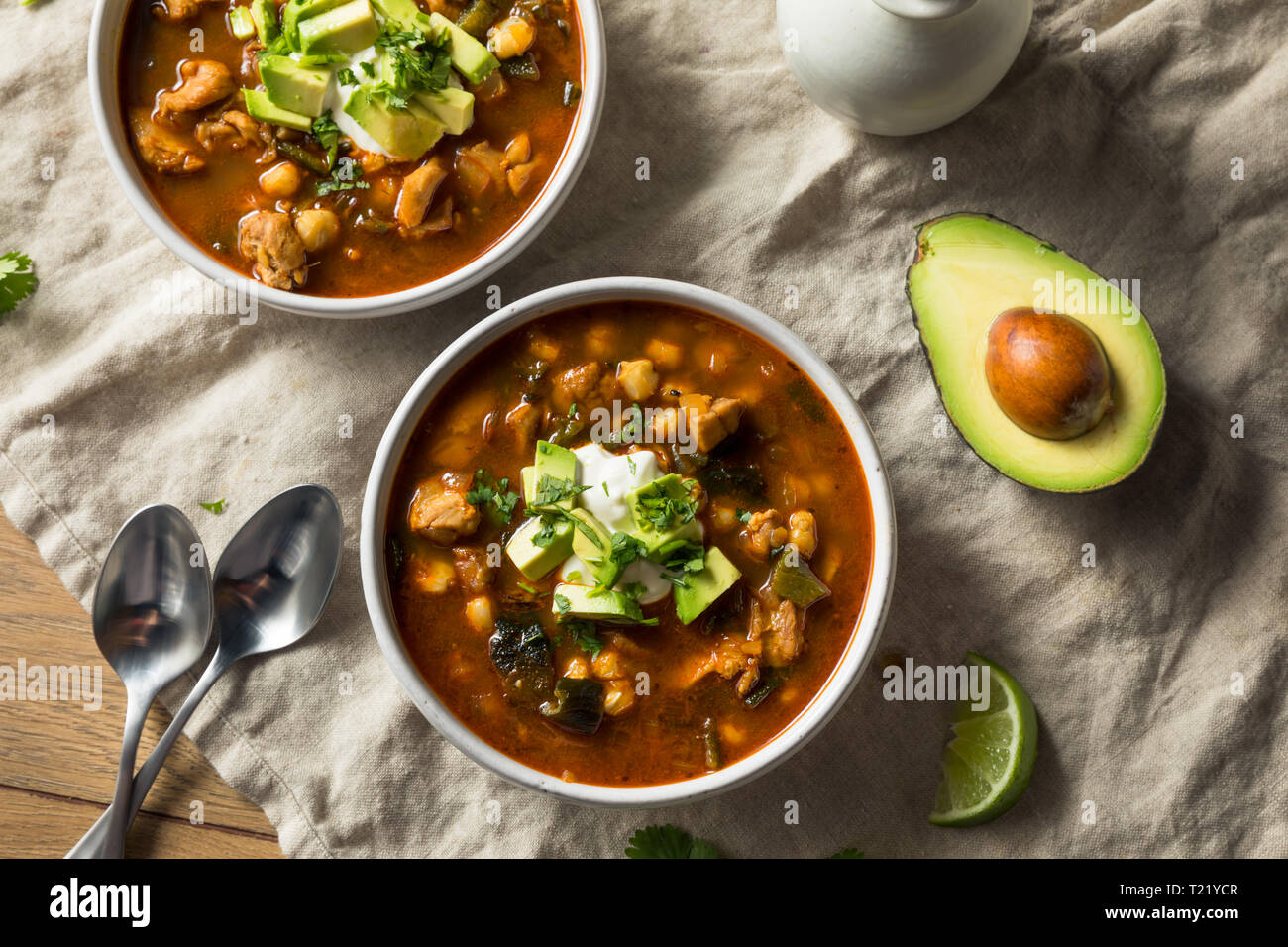 Homemade Mexican Pozole Soup with Chicken and Avocado Stock Photo