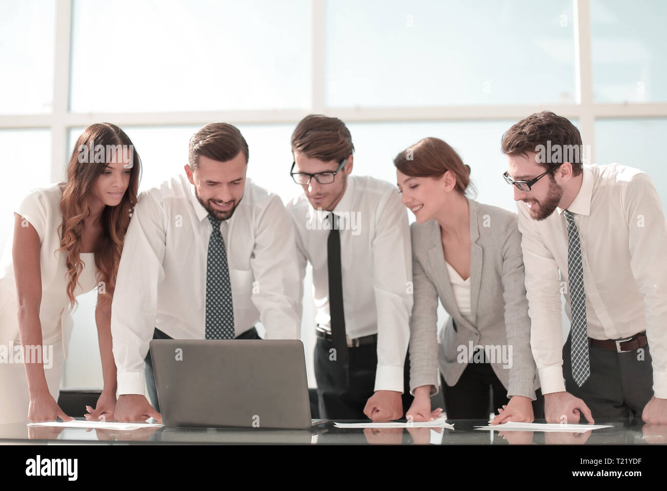 business team standing near the desktop Stock Photo - Alamy