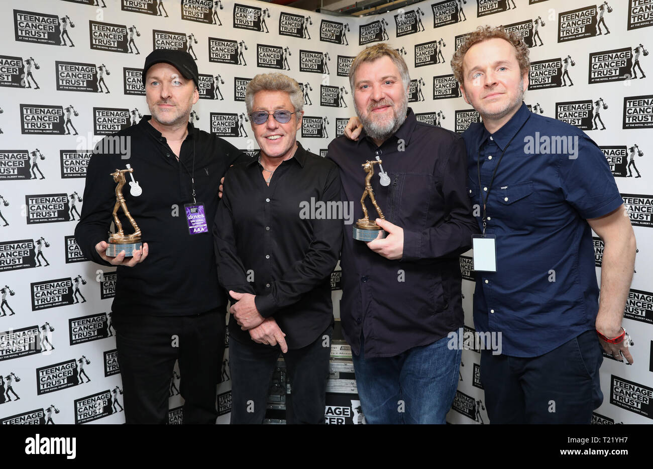 TCT's Honorary Patron Roger Daltrey CBE gives an award to Doves ahead of their performance during the Teenage Cancer Trust Concert, Royal Albert Hall, London. Stock Photo