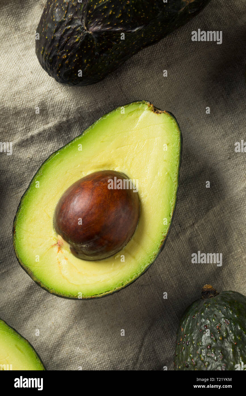 Raw Organic Green Avocados Ready to Cut Open Stock Photo Alamy