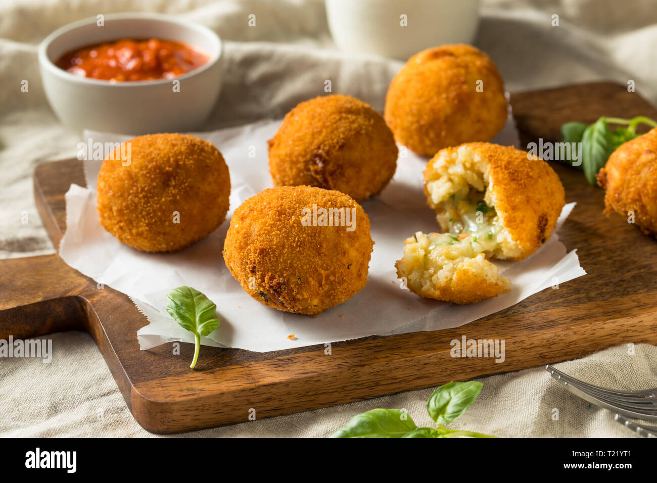 Homemade Deep Fried Risotto Arancini with Basil and Marinara Stock Photo Alamy