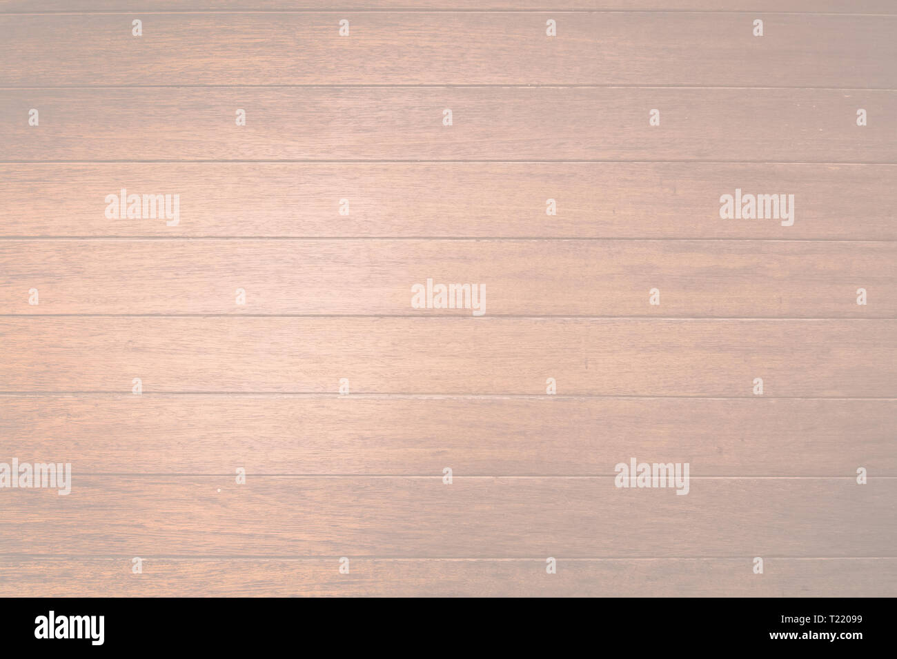 Brown wood planks background texture closeup toned in trend color Living Coral. Stock Photo