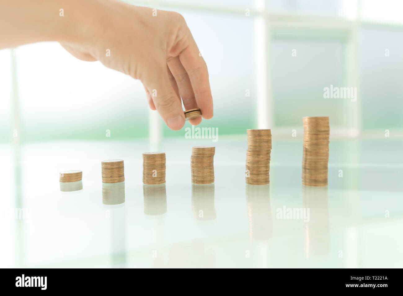 close up. businessman stacking coins on office Desk. photo with copy ...