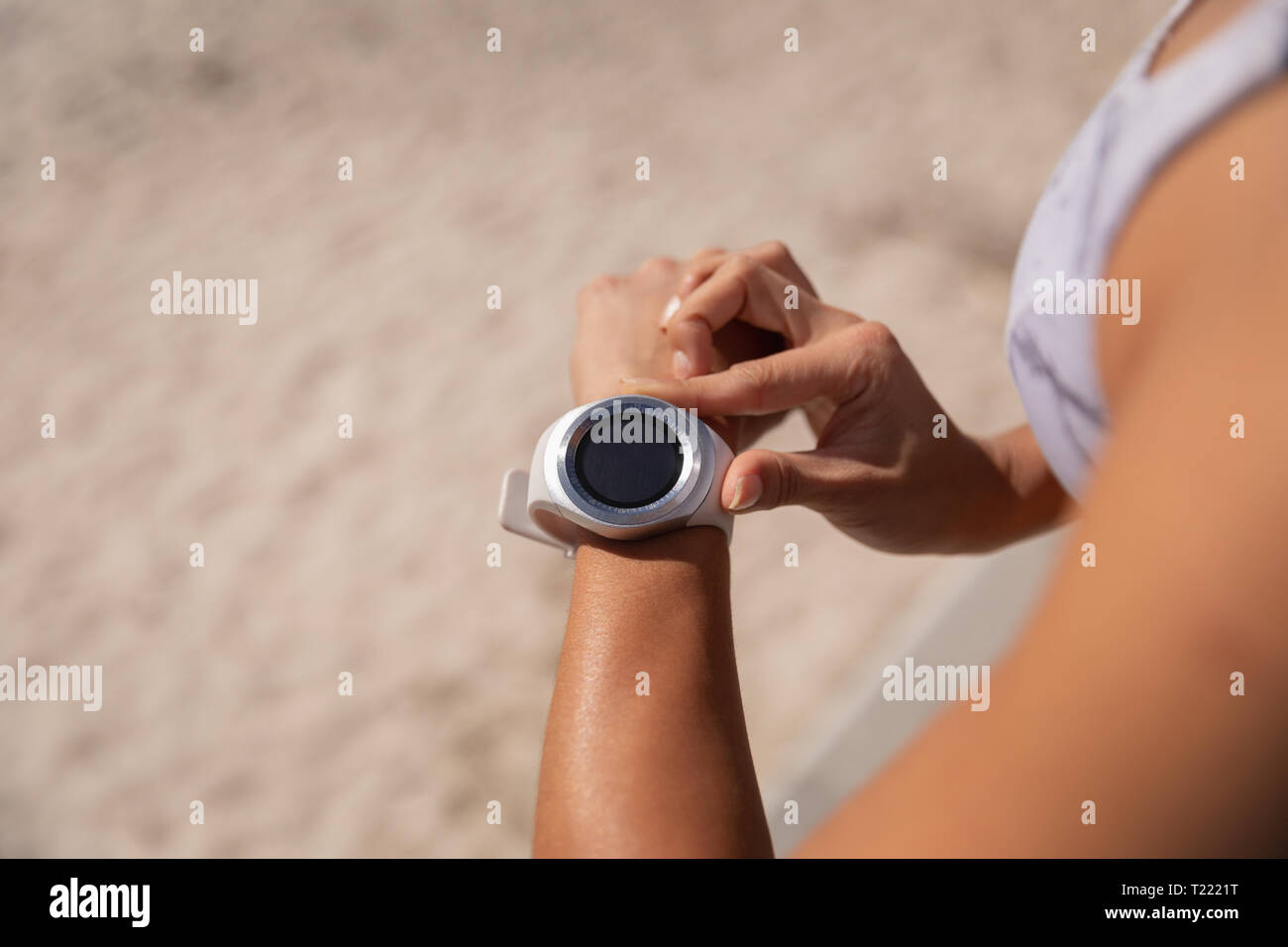 Beautiful woman using smartwatch Stock Photo