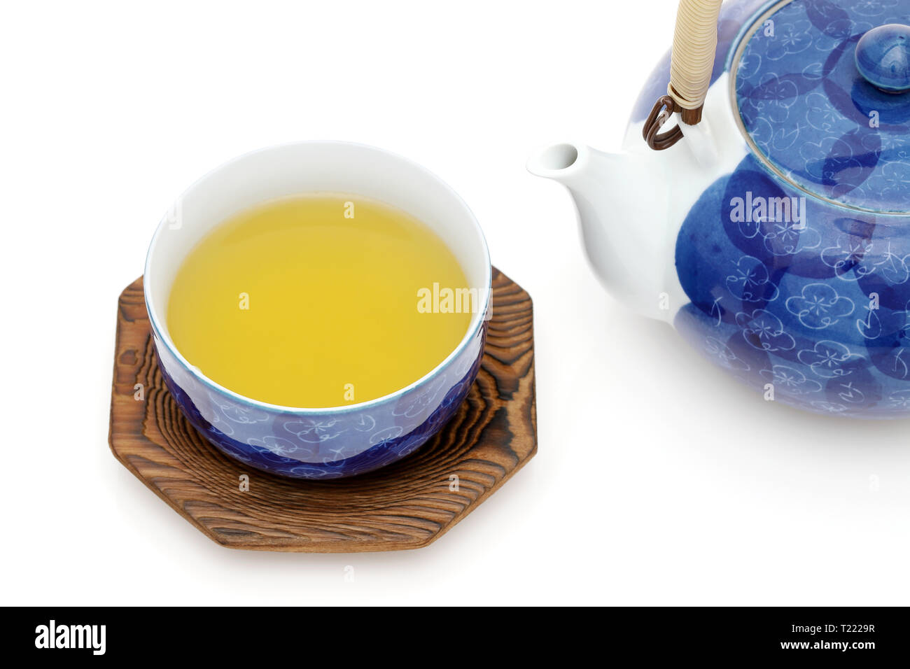 Japanese green tea with cup isolated on a white background Stock Photo