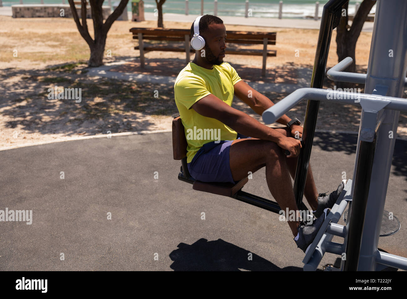 Man doing  back exercise rowing machine Stock Photo