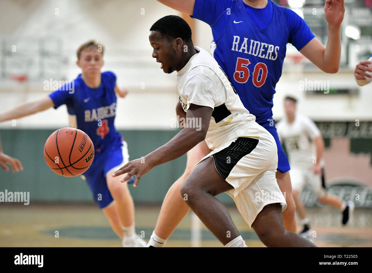 Player losing control of the basketball while driving along the baseline  under the opposing basket. USA Stock Photo - Alamy
