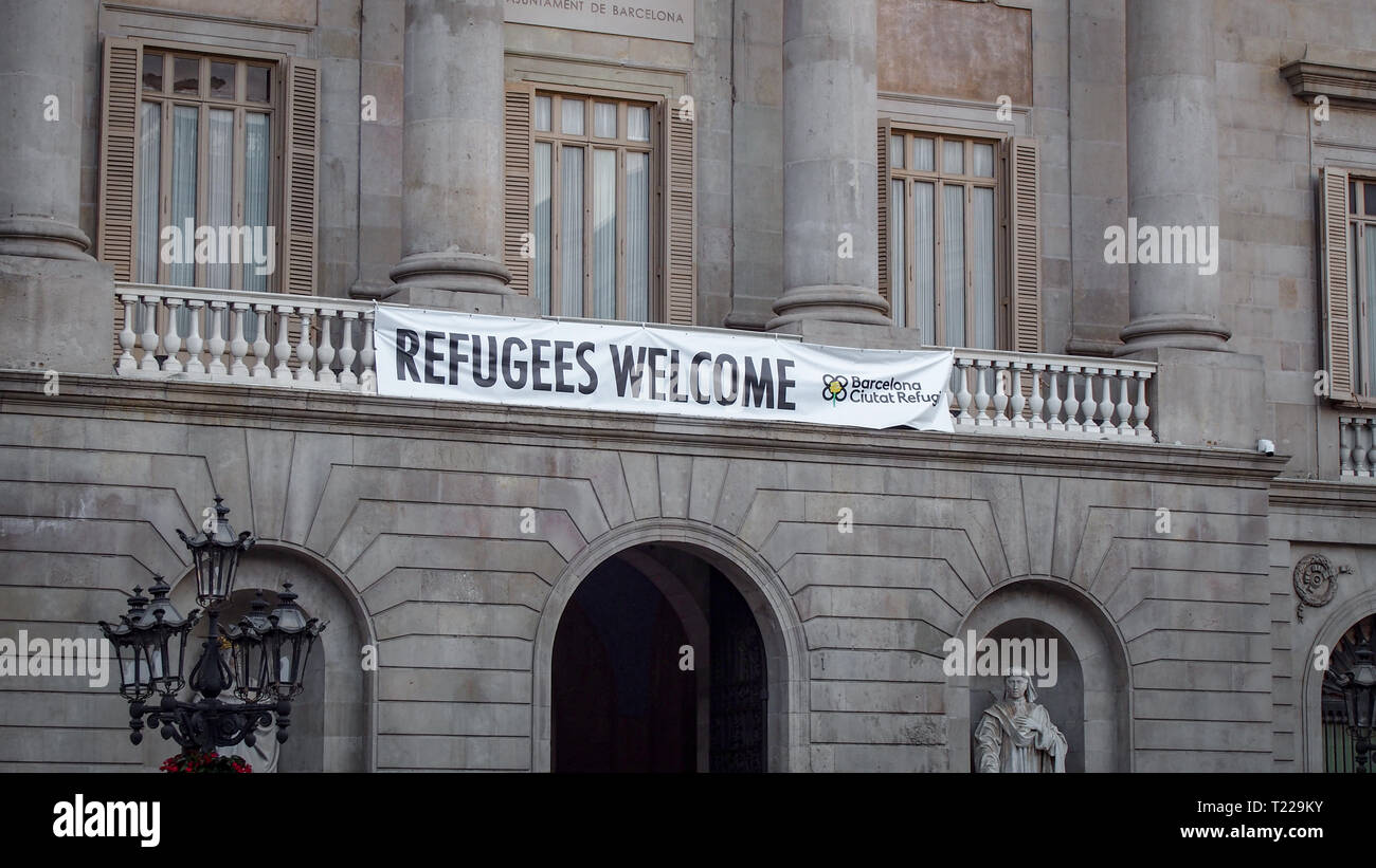 Refugees welcome banner on the The City Hall of Barcelona, Spain Stock Photo