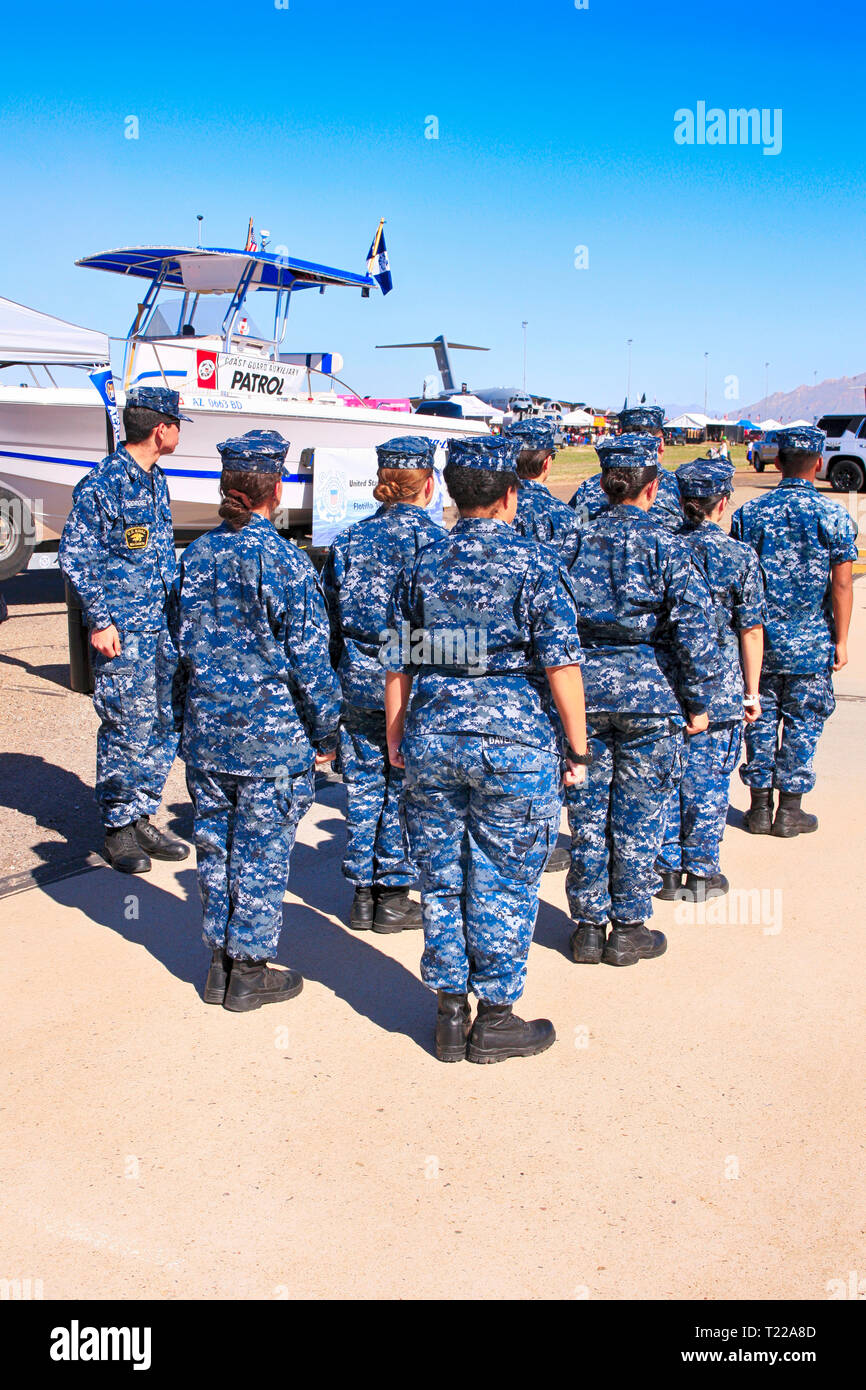 Sailors of the USCG in camouflage blue uniforms undergoing a drill exercise at the Davis-Monthan AFB airshow day in Tucson AZ Stock Photo