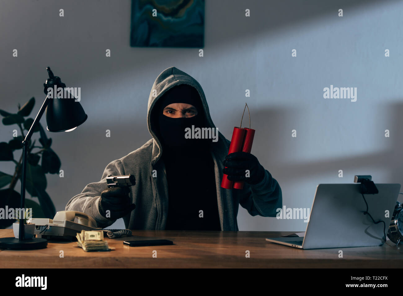 Angry Terrorist In Mask Holding Gun And Dynamite While