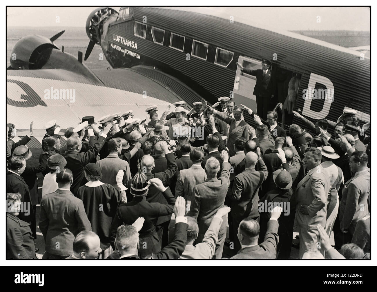 Vintage 1930's pre-war B&W image of Hermann Göring leading German Nazi and head of the German Luftwaffe arriving in Hungary 'Mátyásföldön' in a German Junkers Ju 52 with 'Lufthansa' insignia on fuselage Crowd greet him with Heil Hitler salutes 1935 Stock Photo