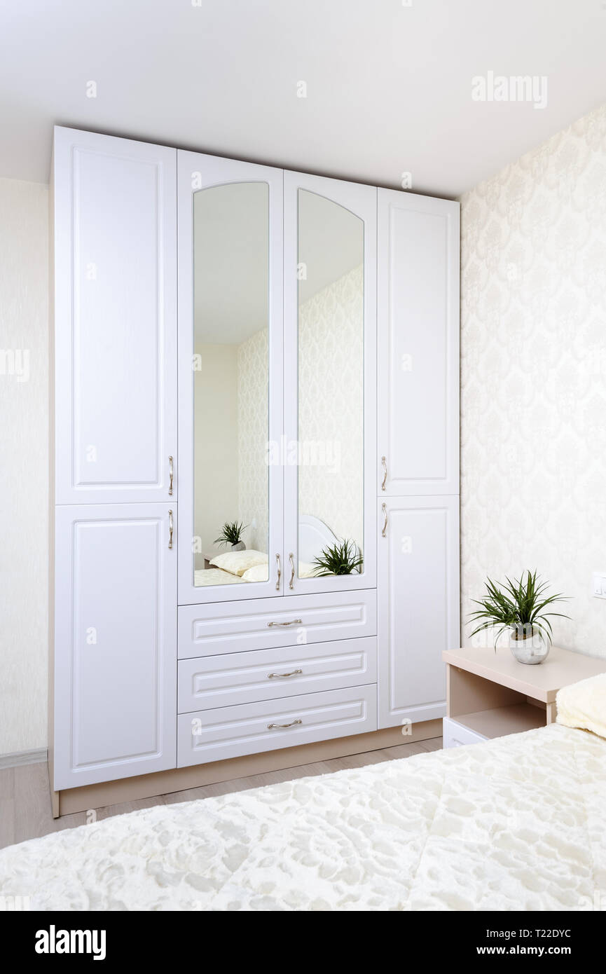 Modern bedroom with wardrobe double bed Stock Photo Alamy