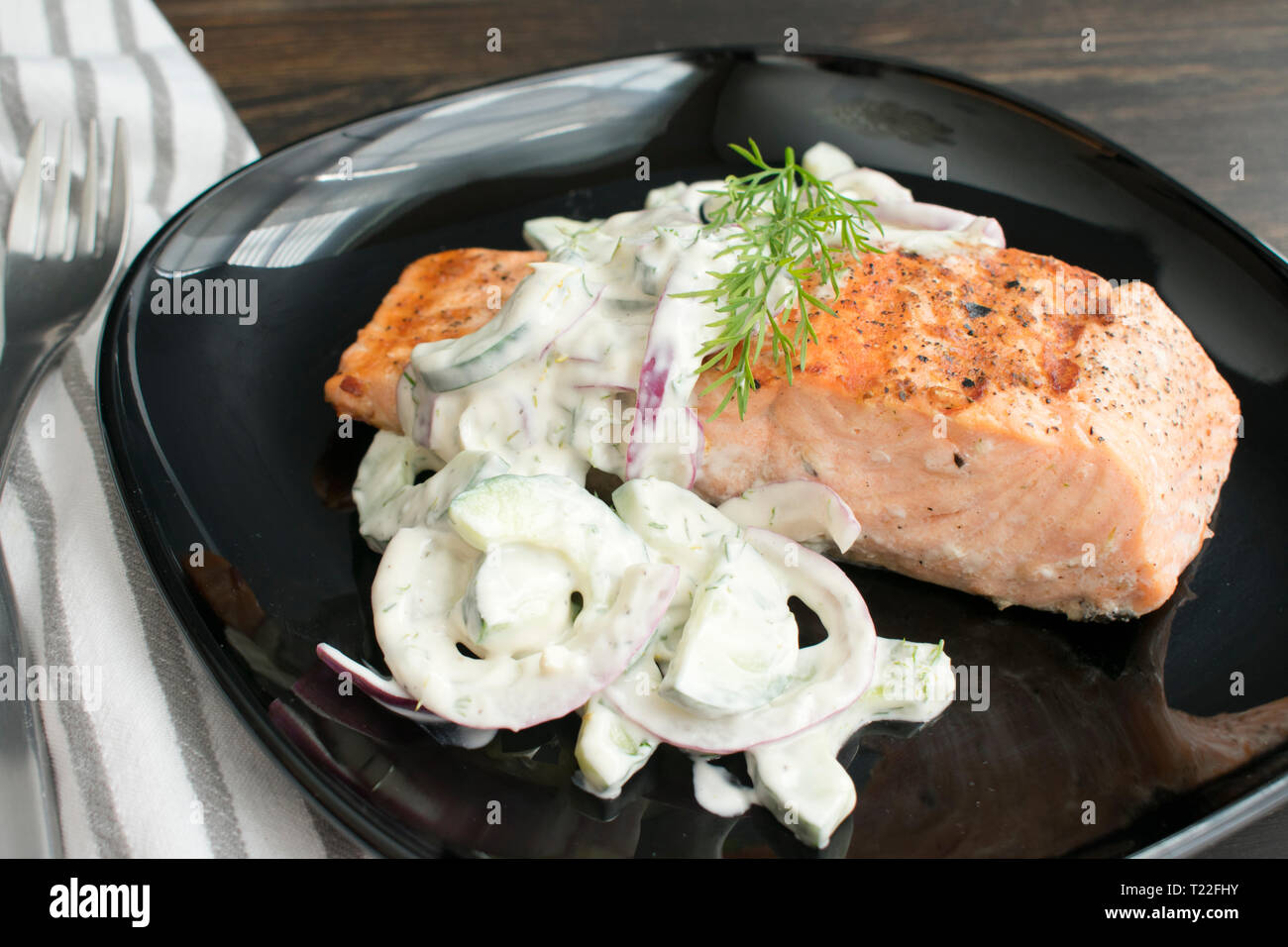 Grilled Salmon with Cucumber-Dill Salad Stock Photo