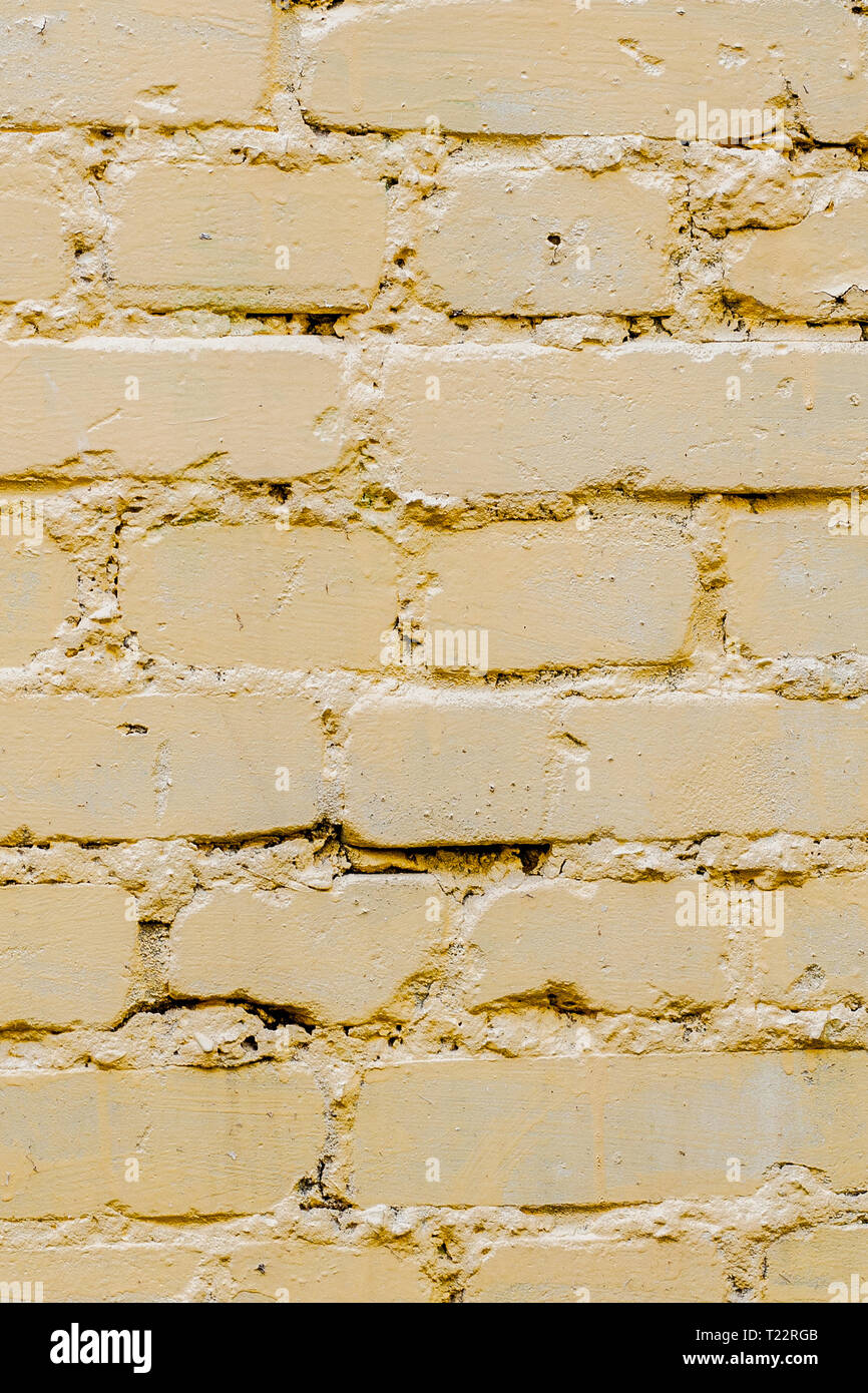 Yellow bricks pattern on wall for abstract background. Stock Photo