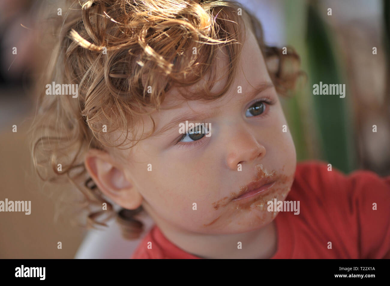 Baby eating chocolate Stock Photo