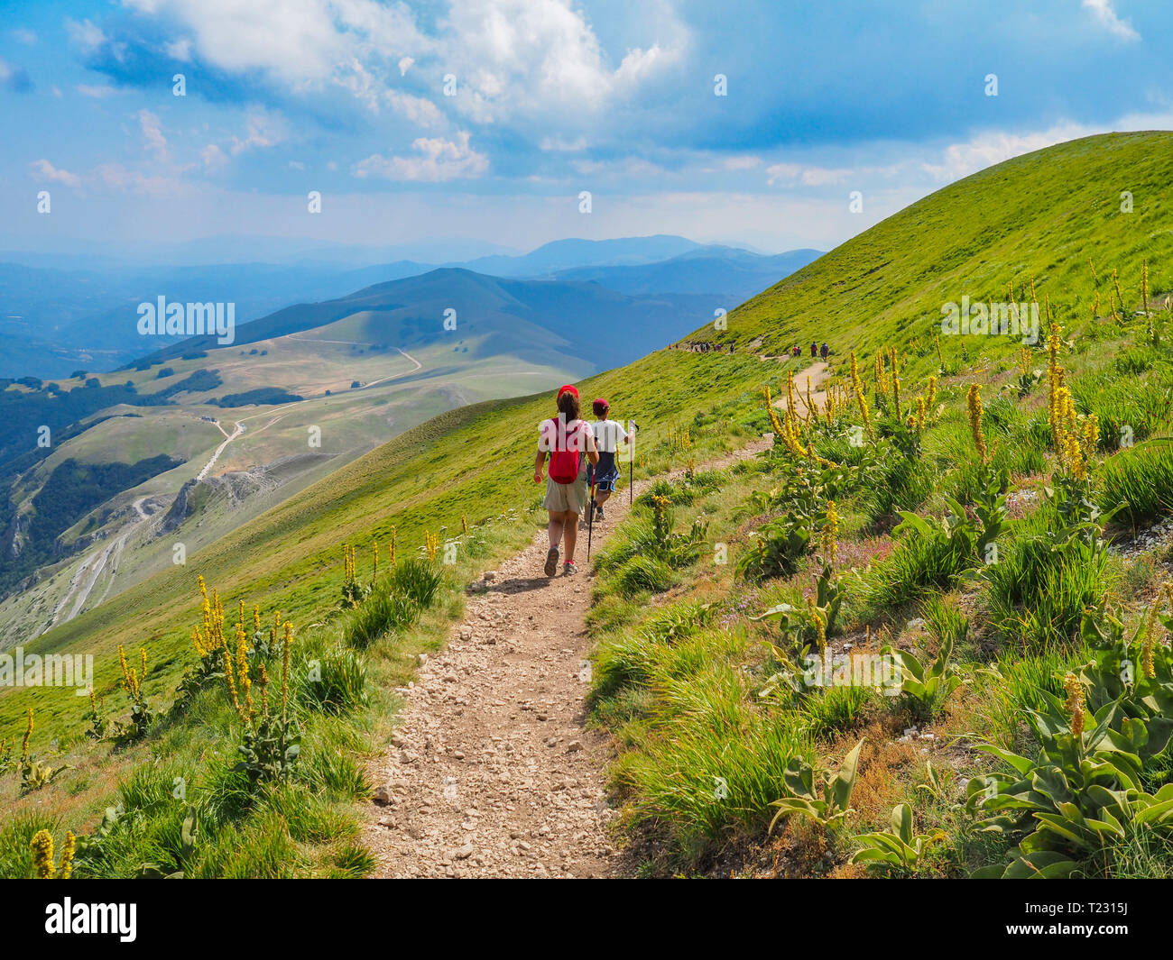 Italy, Umbria, Sibillini mountains, two children hiking mount Vettore ...