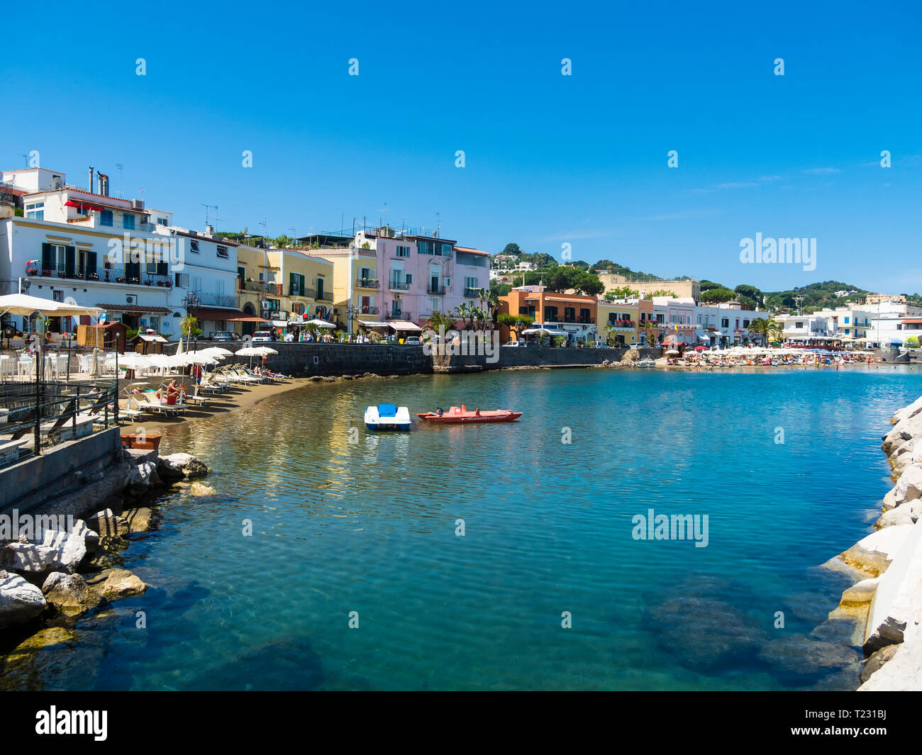 Italy, Campagnia, Ischia, Lacco Ameno, Beach with colorful buildings Stock Photo